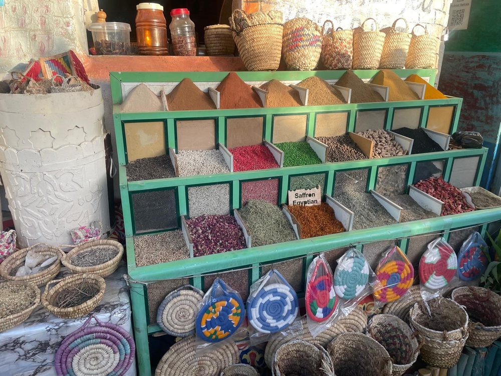 A Nubian spice stall, its shelves filled with saffron, hibiscus and dried herbs