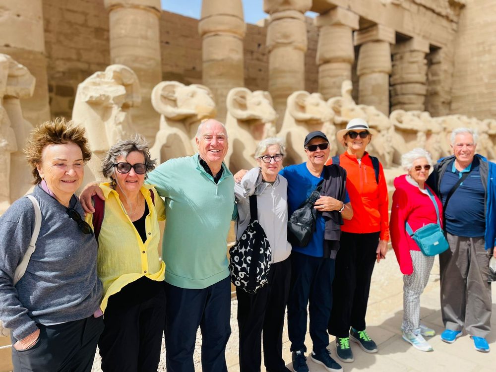 A group of Explorers among the ram-headed sphinxes at Karnak Temple
